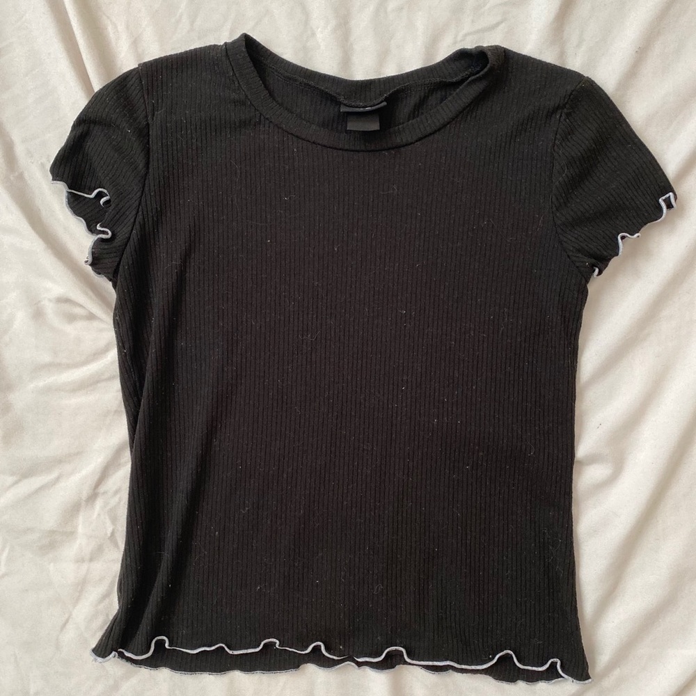 White ruffle edged top